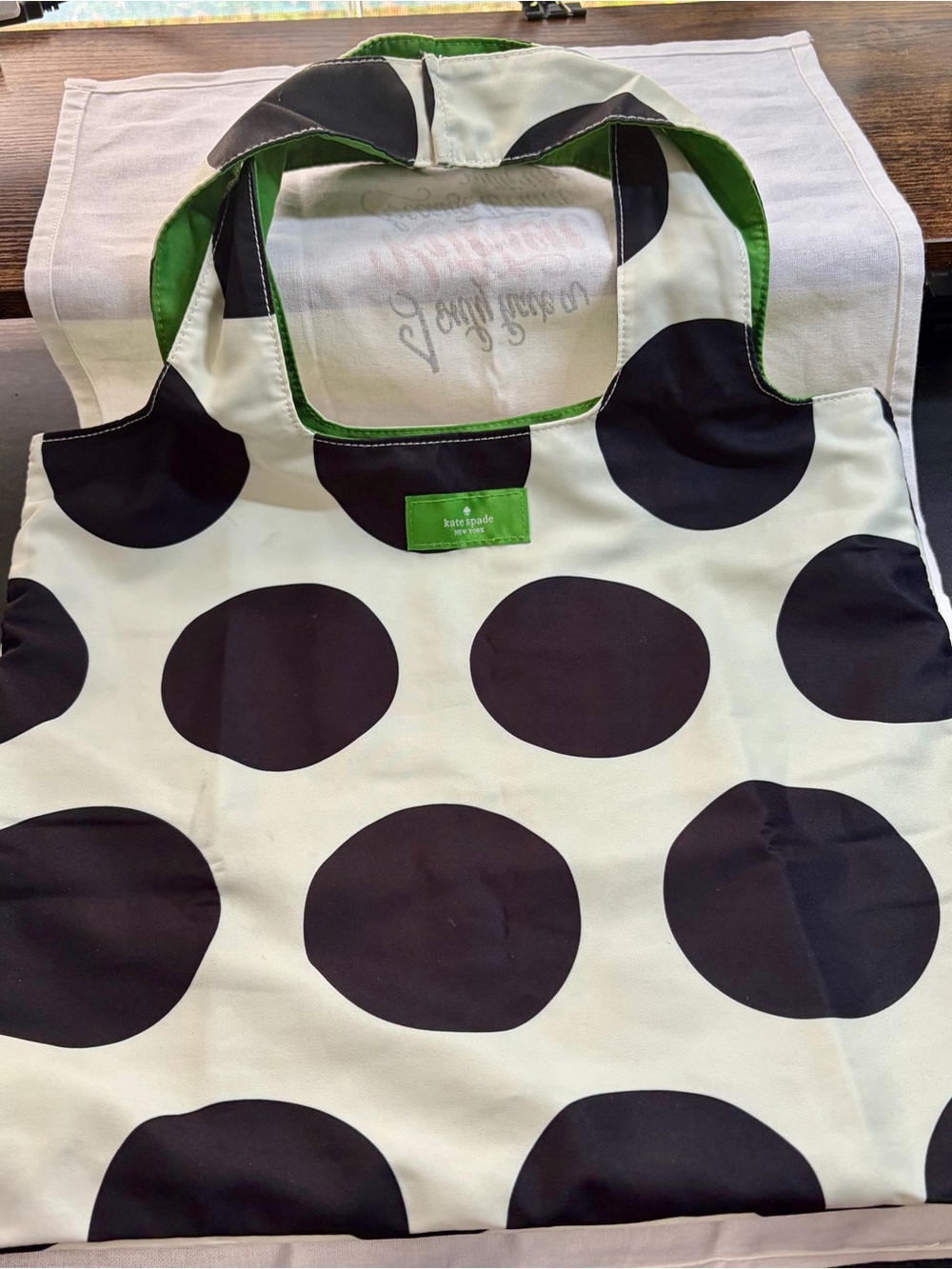 kate spade Reversible Black Polka Dot Cream Tote with Green Interior.